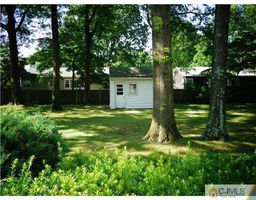 59 Orchard Road Middlesex, NJ 08846 - Photo 2 of 24 a view of a backyard with large trees