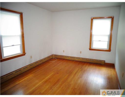 59 Orchard Road Middlesex, NJ 08846 - Photo 11 of 24 a view of a room with wooden floor and a window
