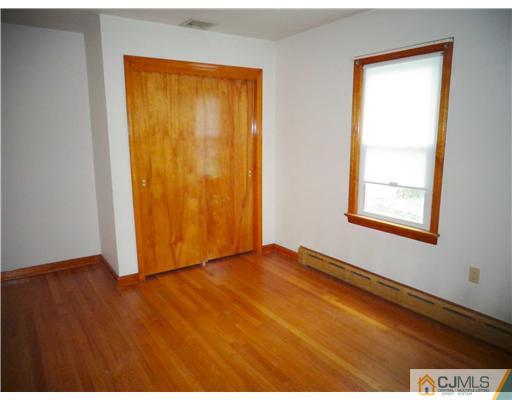 59 Orchard Road Middlesex, NJ 08846 - Photo 12 of 24 a view of an empty room with closet and a window