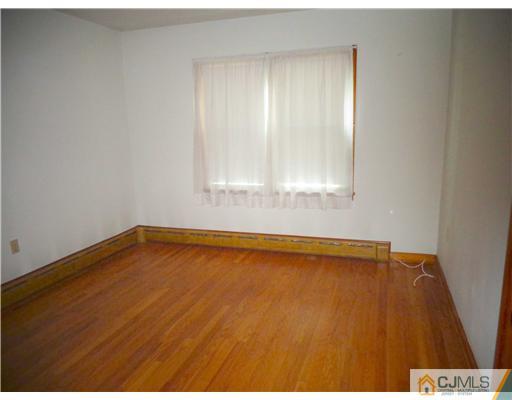 59 Orchard Road Middlesex, NJ 08846 - Photo 13 of 24 a view of an empty room with a window