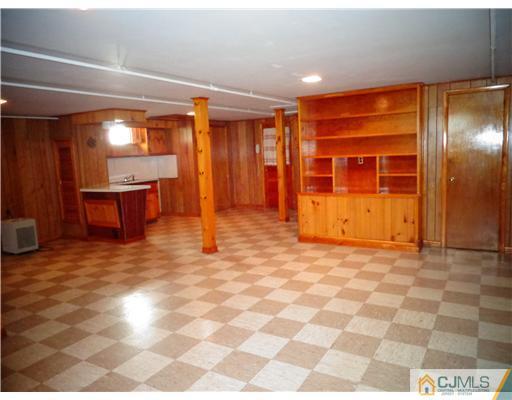 59 Orchard Road Middlesex, NJ 08846 - Photo 19 of 24 a view of an empty room with window and a kitchen