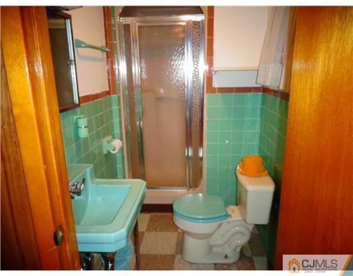 59 Orchard Road Middlesex, NJ 08846 - Photo 22 of 24 a bathroom with a sink and toilet