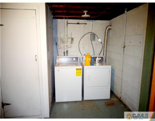 59 Orchard Road Middlesex, NJ 08846 - Photo 23 of 24 a utility room with dryer and washer