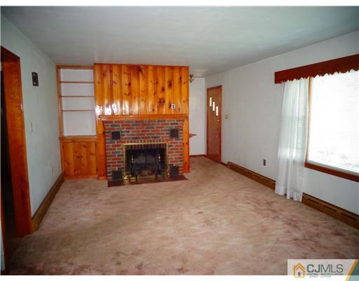 59 Orchard Road Middlesex, NJ 08846 - Photo 5 of 24 a view of empty room with a fireplace