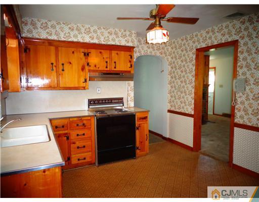 59 Orchard Road Middlesex, NJ 08846 - Photo 9 of 24 a kitchen view of a fireplace