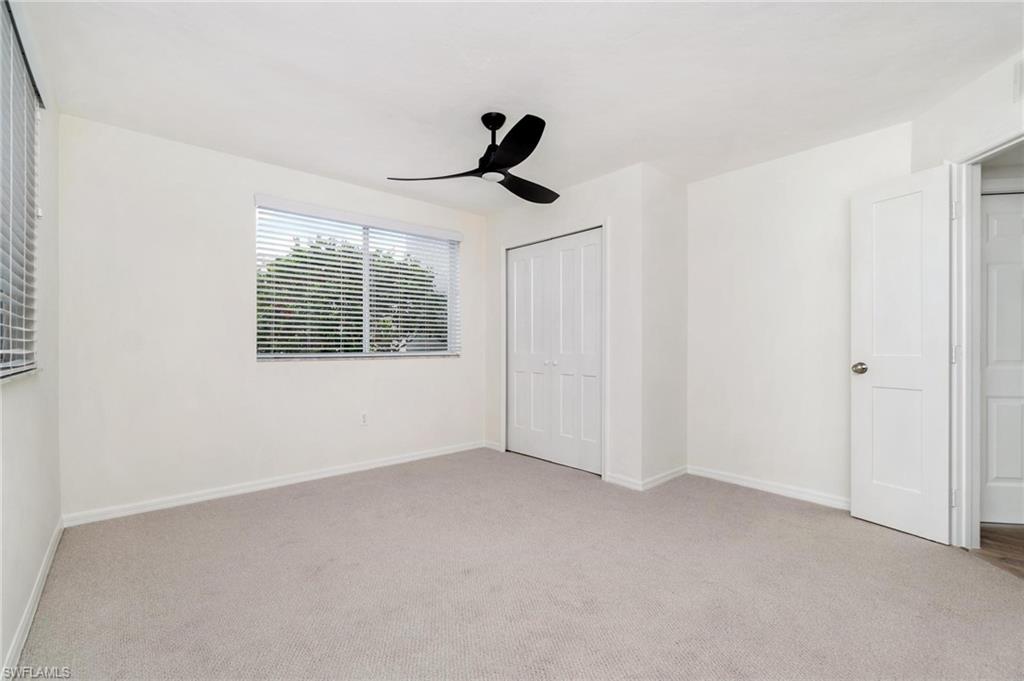 285 Naples Cove Drive, Unit 1106 Naples, FL 34110 - Photo 15 of 46 a view of an empty room with a window