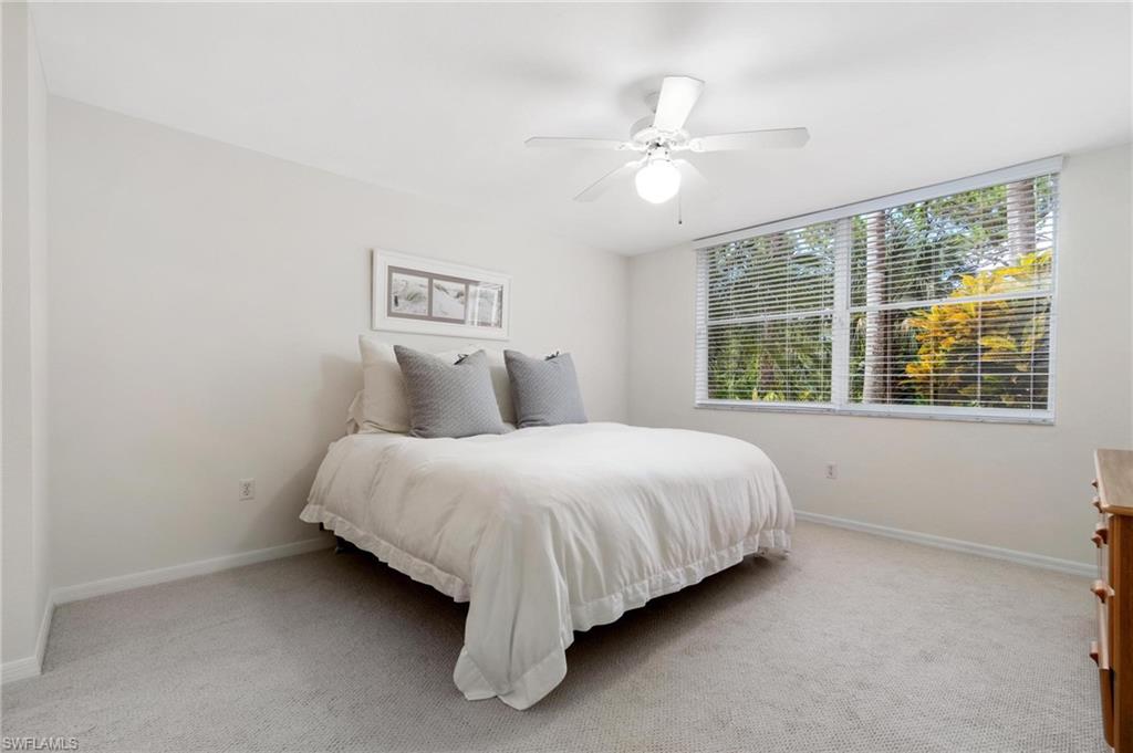 285 Naples Cove Drive, Unit 1106 Naples, FL 34110 - Photo 21 of 46 a bedroom with a bed and window