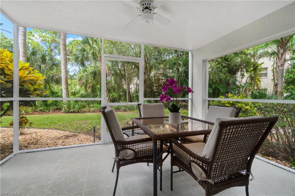 285 Naples Cove Drive, Unit 1106 Naples, FL 34110 - Photo 31 of 46 a view of a porch with furniture and yard