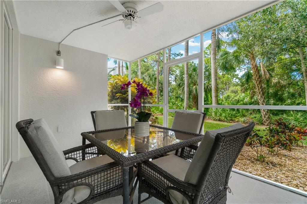 285 Naples Cove Drive, Unit 1106 Naples, FL 34110 - Photo 32 of 46 a view of a dining room with furniture window and outside view