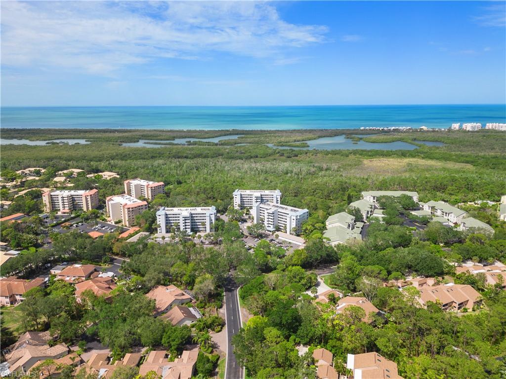 285 Naples Cove Drive, Unit 1106 Naples, FL 34110 - Photo 38 of 46 a view of a city with an ocean
