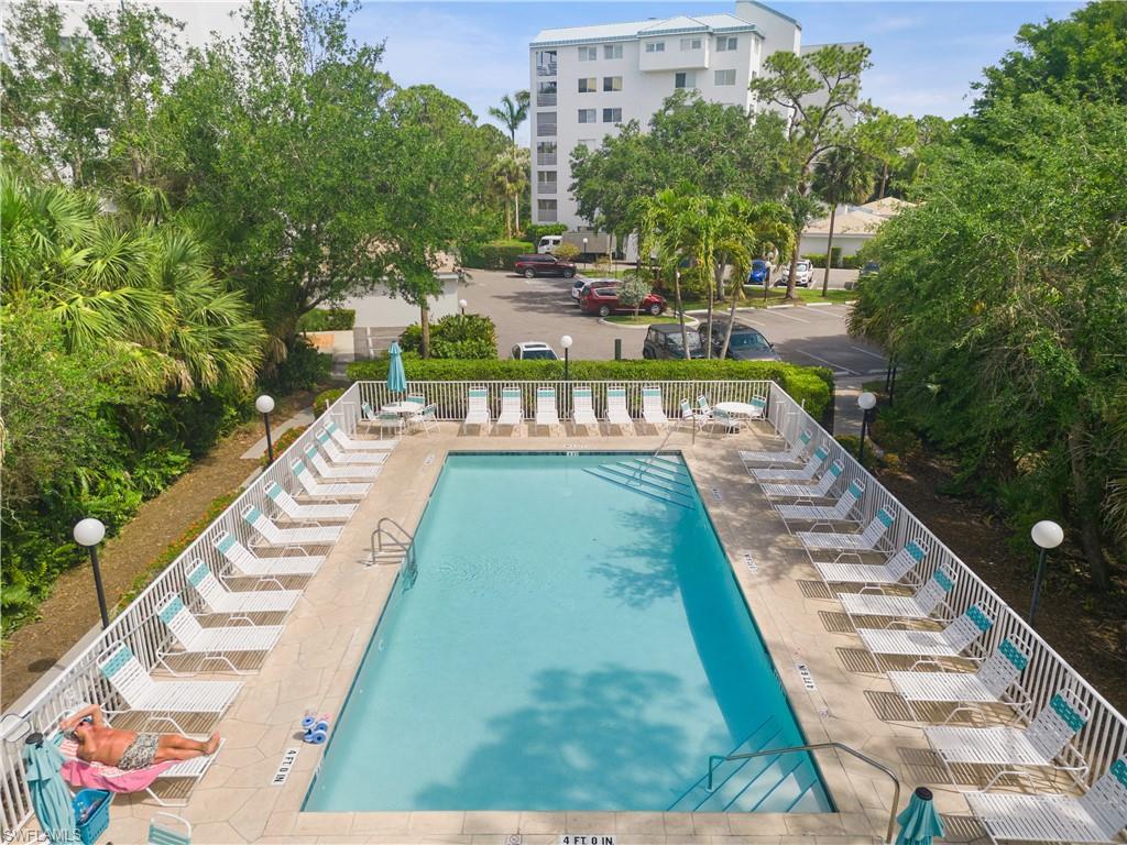 285 Naples Cove Drive, Unit 1106 Naples, FL 34110 - Photo 40 of 46 a view of swimming pool with a patio