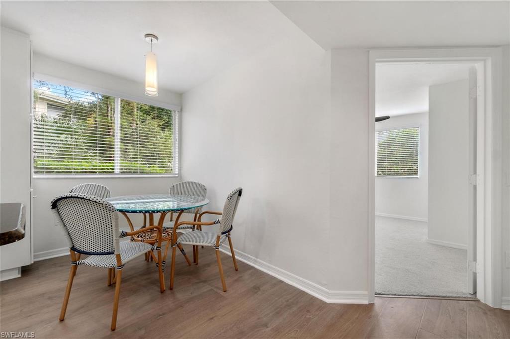 285 Naples Cove Drive, Unit 1106 Naples, FL 34110 - Photo 4 of 46 a view of a dining room with furniture window and outside view