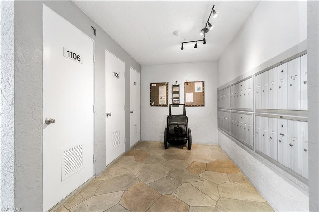 285 Naples Cove Drive, Unit 1106 Naples, FL 34110 - Photo 43 of 46 a view of entryway with white walls