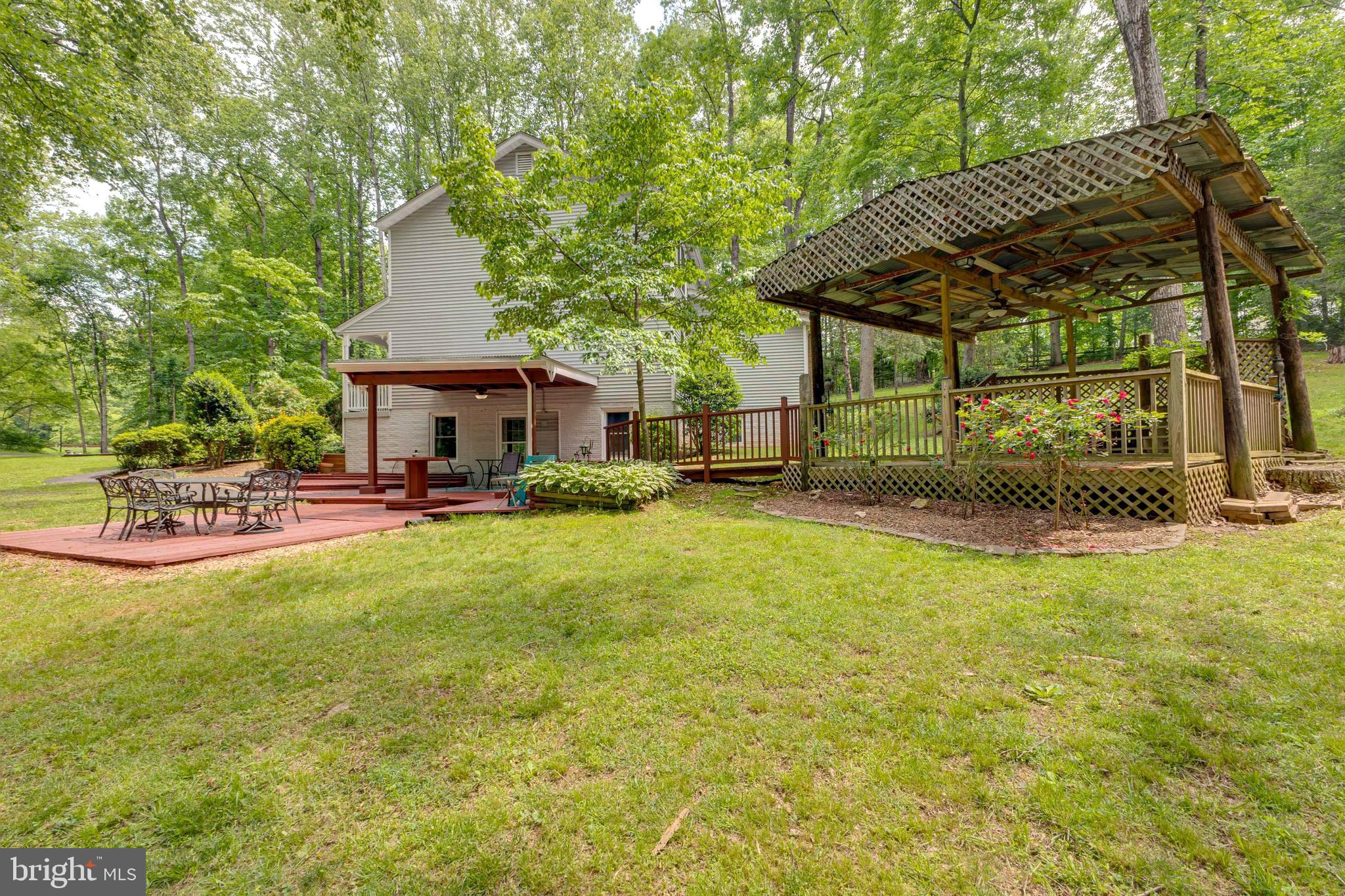 12320 Running Deer Road Manassas, VA 20112 - Photo 3 of 39 Side yard view with comfortable decking