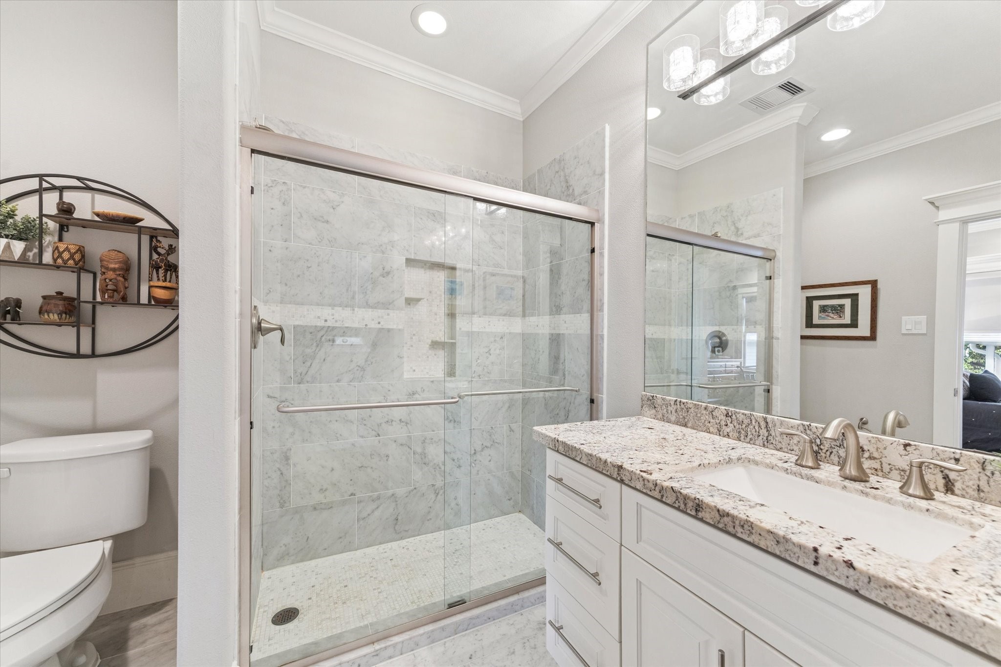 209 West 24th Street Houston, TX 77008 - Photo 24 of 36 Ensuite bathroom with a glass enclosed shower, granite countertop and ample storage.