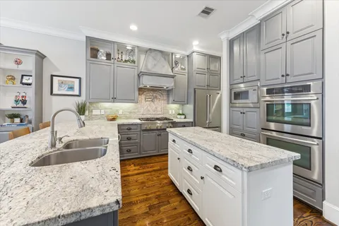a living room with furniture a ceiling fan and a fireplace