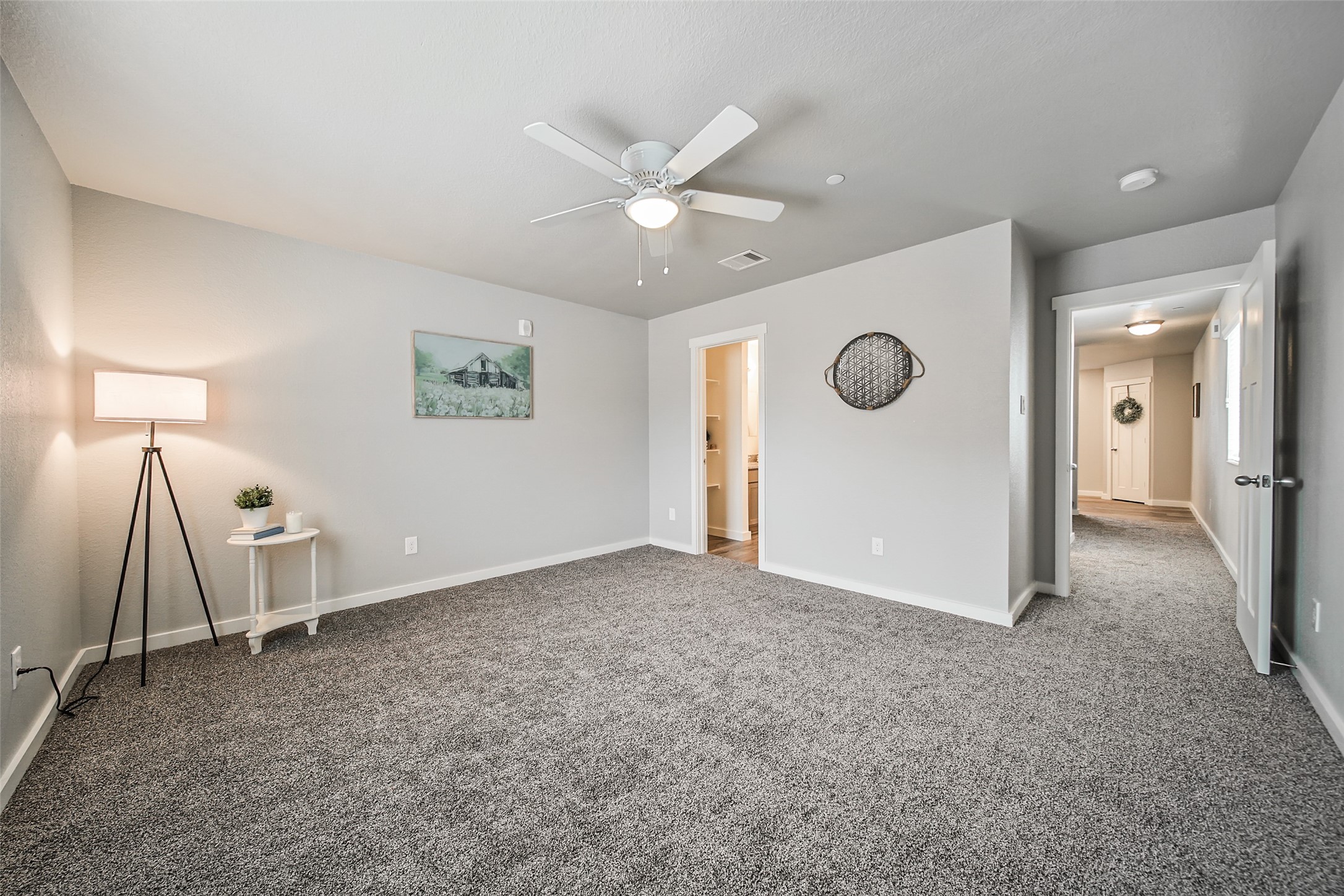 21155 Gosling Road, Unit 15 CD Spring, TX 77388 - Photo 12 of 34 a view of an empty room with a ceiling fan and window