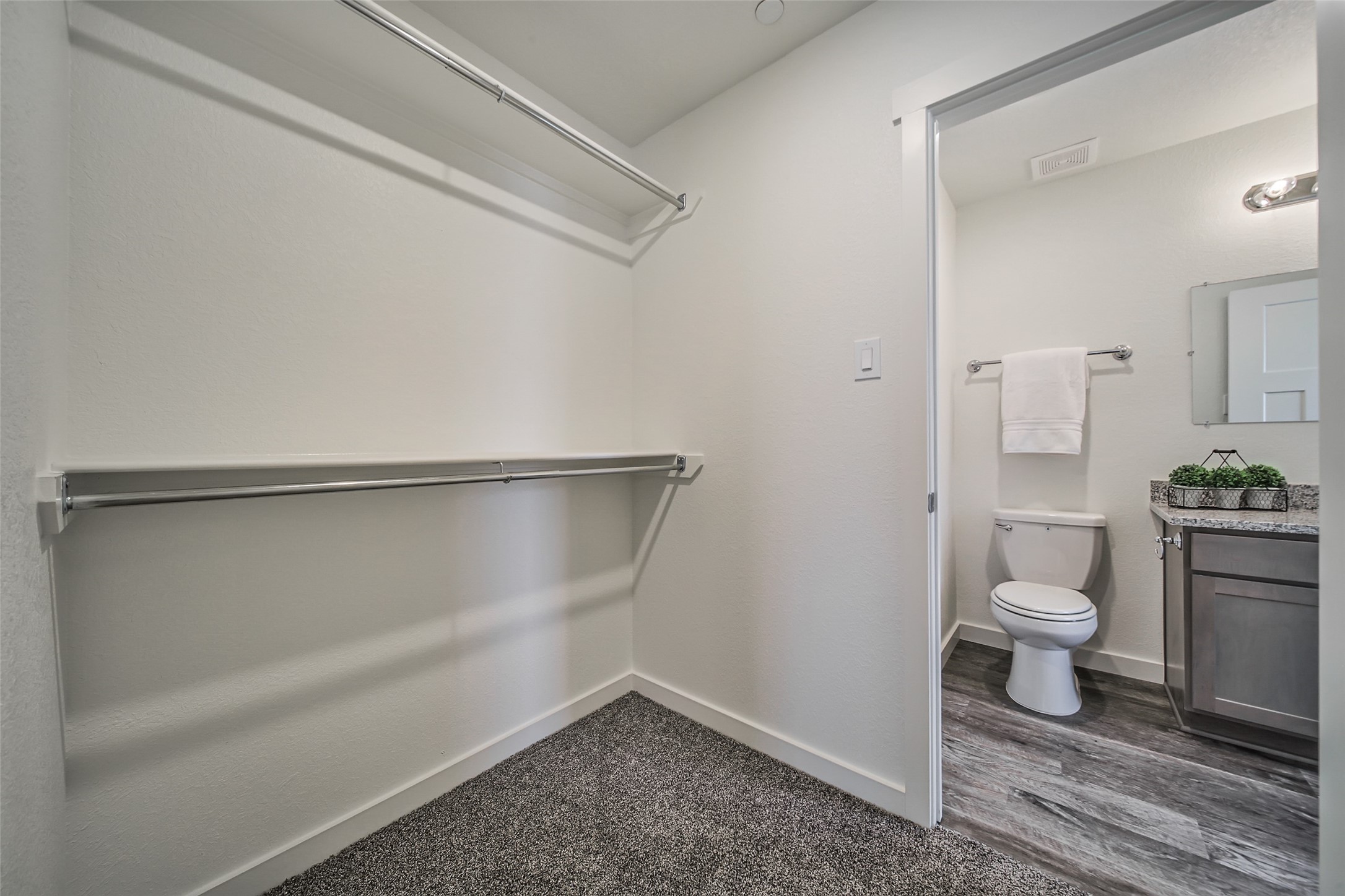 21155 Gosling Road, Unit 15 CD Spring, TX 77388 - Photo 22 of 34 a bathroom with a granite countertop toilet and a shower