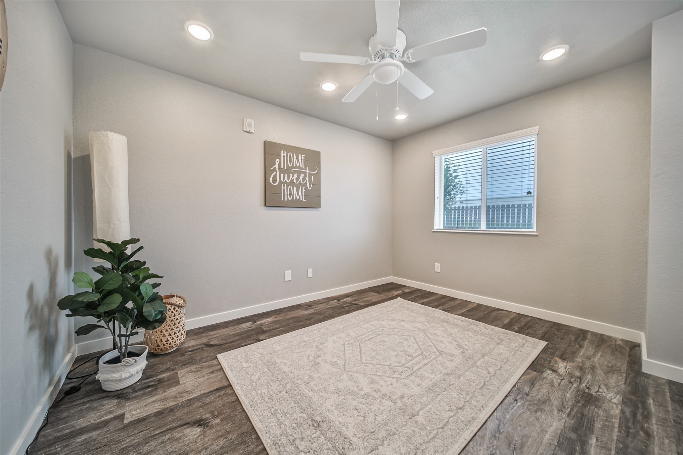 21155 Gosling Road, Unit 15 CD Spring, TX 77388 - Photo 3 of 34 an empty room with wooden floor and potted plant