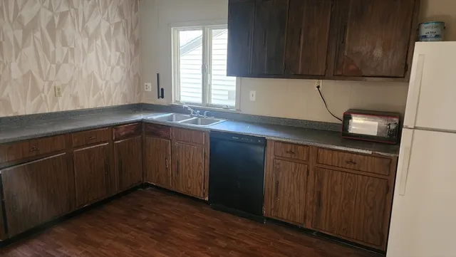 a kitchen with a sink and cabinets