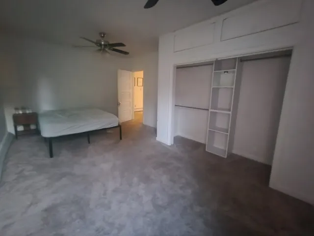 a view of an empty room with a cabinet