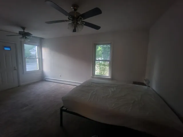 a view of an empty room with a cabinet