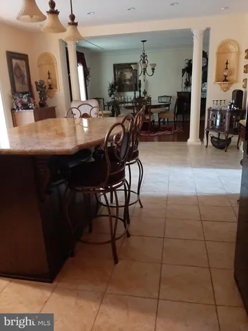 a kitchen with a table and chairs