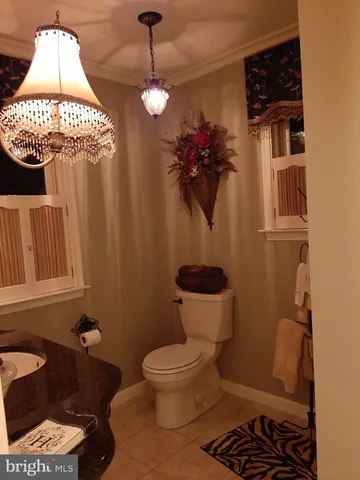 a bedroom with a bed and a double vanity sink