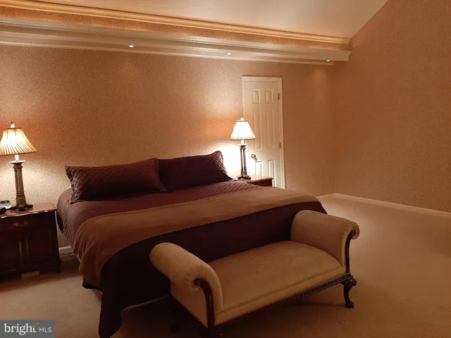 a living room with furniture and a mirror