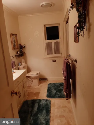 an aerial view of a house with garden space and lake view