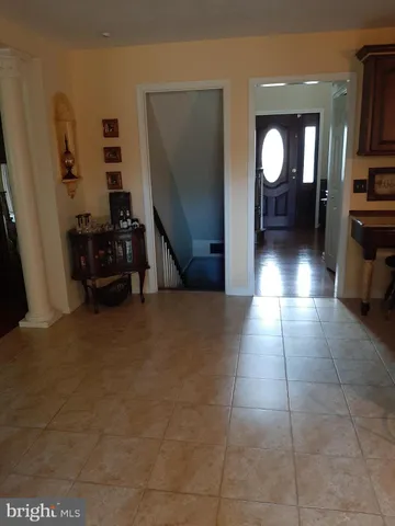 an aerial view of a house with a garden and lake view