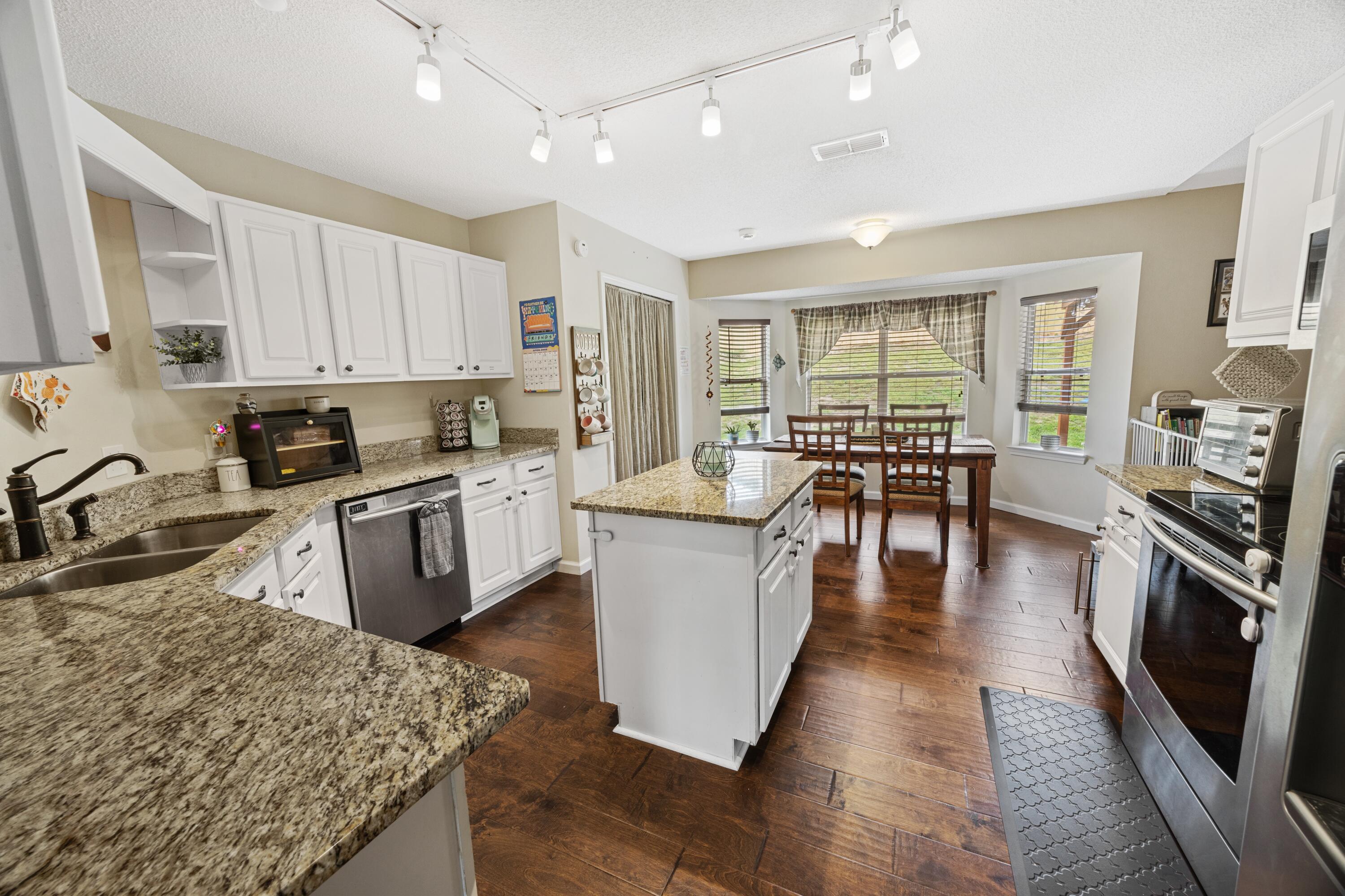 419 Bobby Drive Crestview, FL 32536 - Photo 11 of 42 a large kitchen with lots of counter top space a sink appliances and cabinets