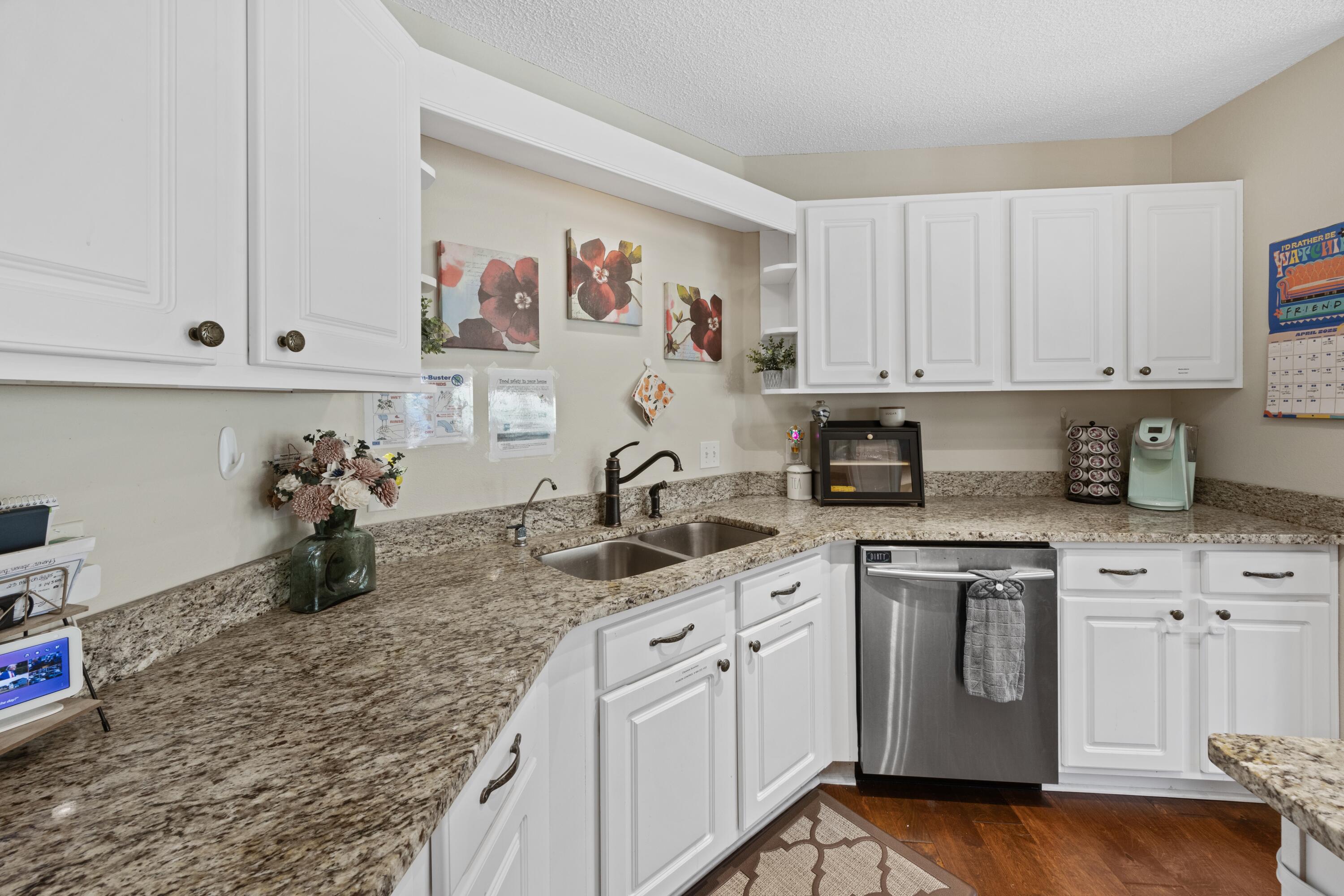 419 Bobby Drive Crestview, FL 32536 - Photo 12 of 42 a kitchen with white cabinets and sink