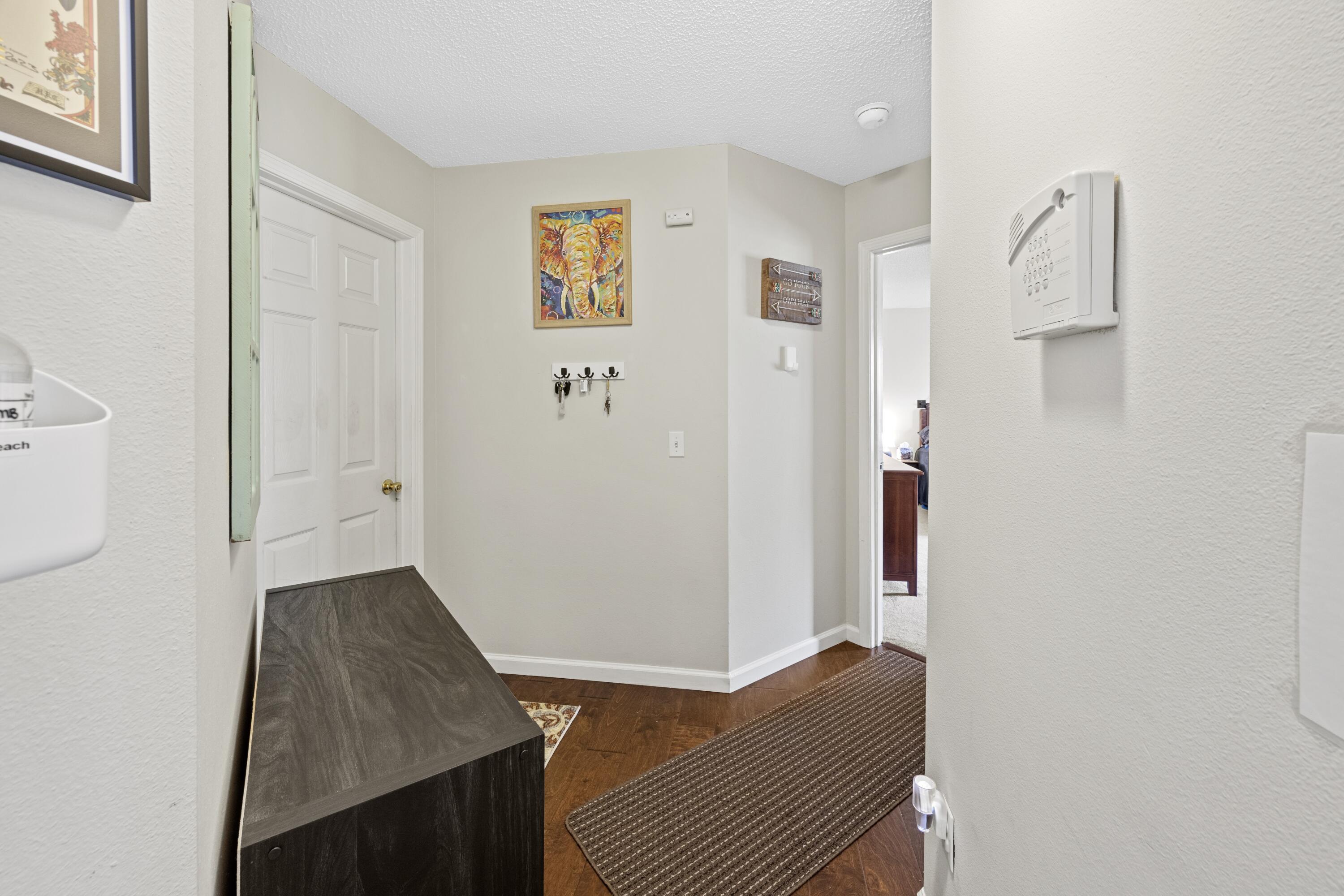419 Bobby Drive Crestview, FL 32536 - Photo 15 of 42 a view of hallway with wooden floor and bathroom