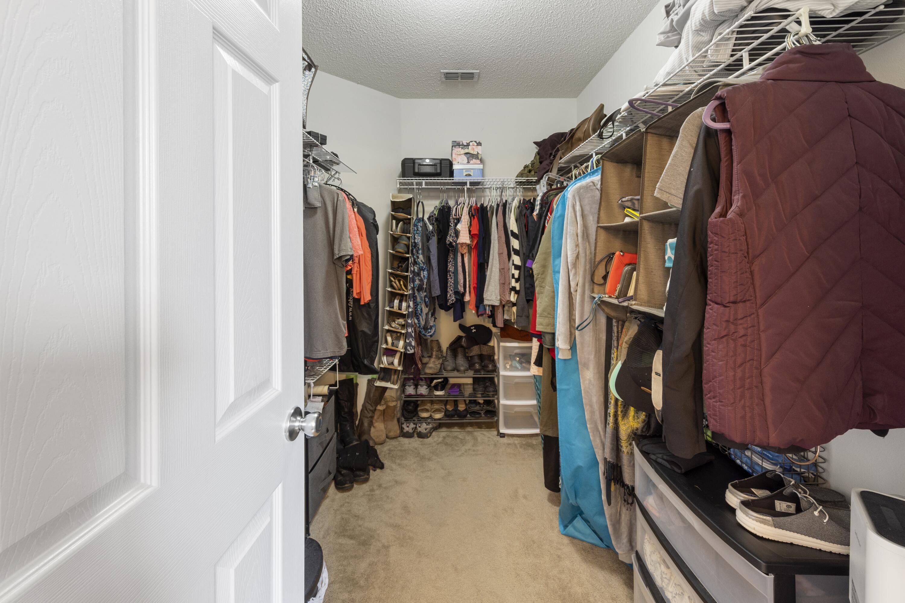 419 Bobby Drive Crestview, FL 32536 - Photo 20 of 42 a view of walk in closet with clothes and shoes