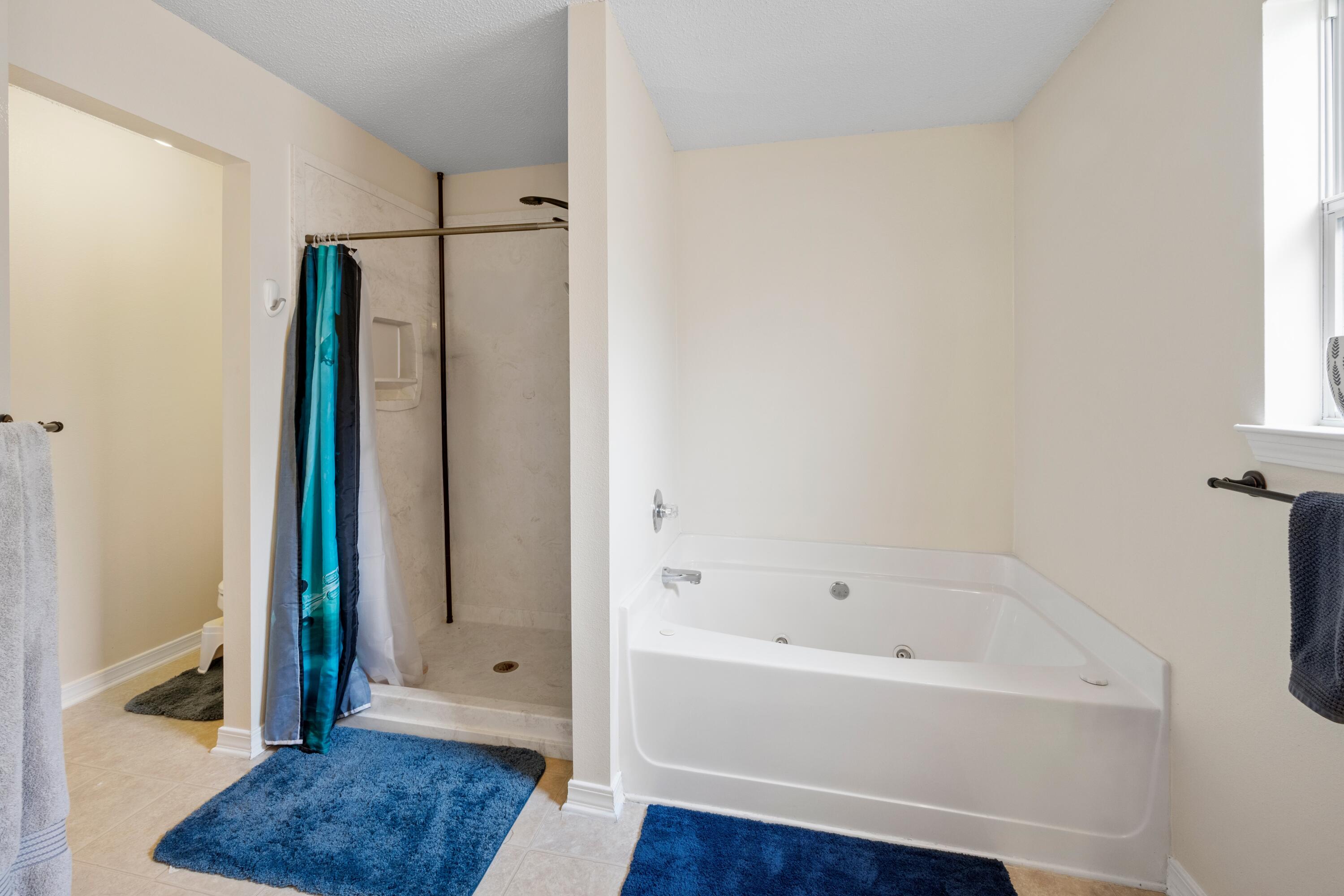 419 Bobby Drive Crestview, FL 32536 - Photo 22 of 42 a bathroom with a bathtub and a shower