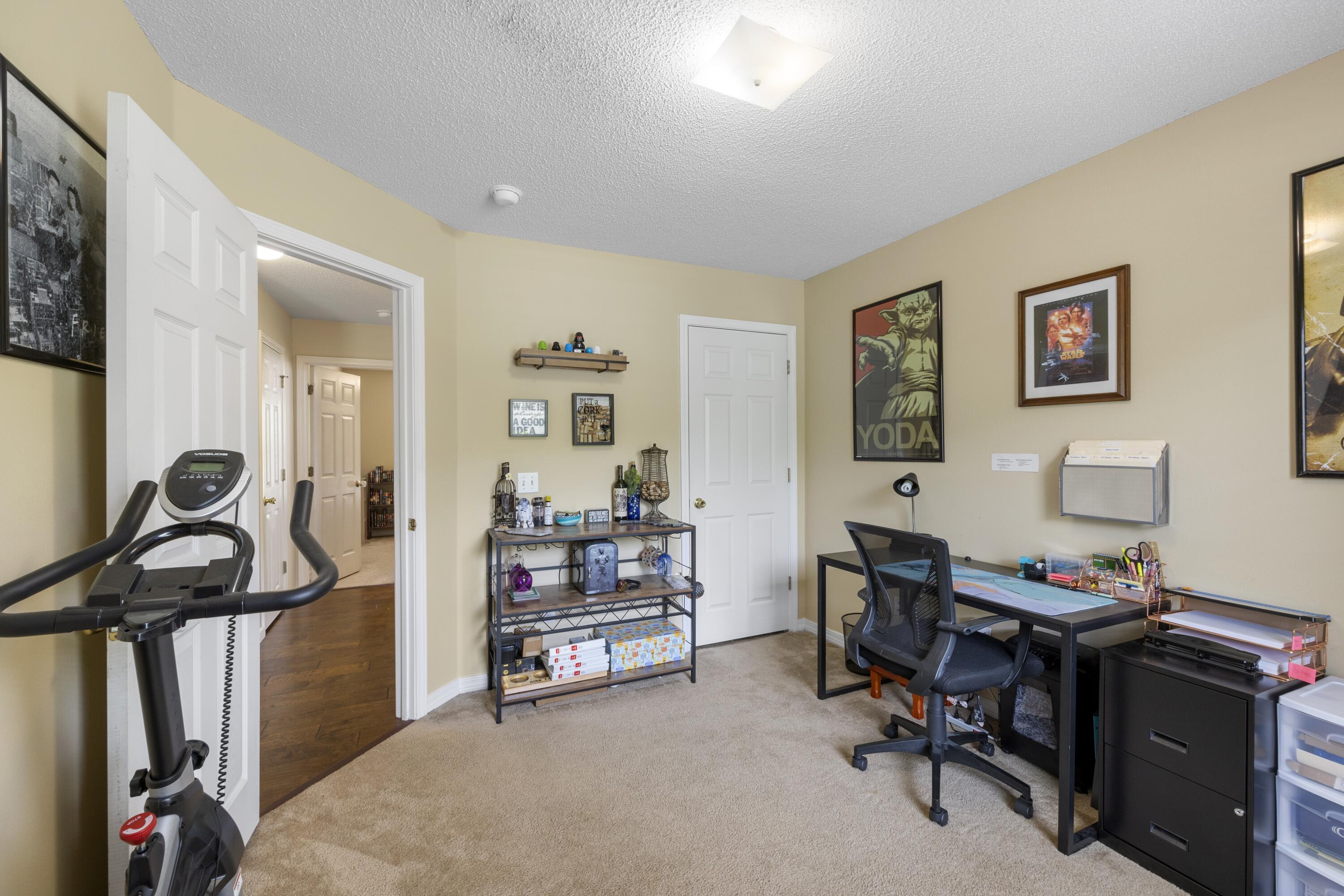 419 Bobby Drive Crestview, FL 32536 - Photo 27 of 42 a view of a workspace with furniture and a livingroom