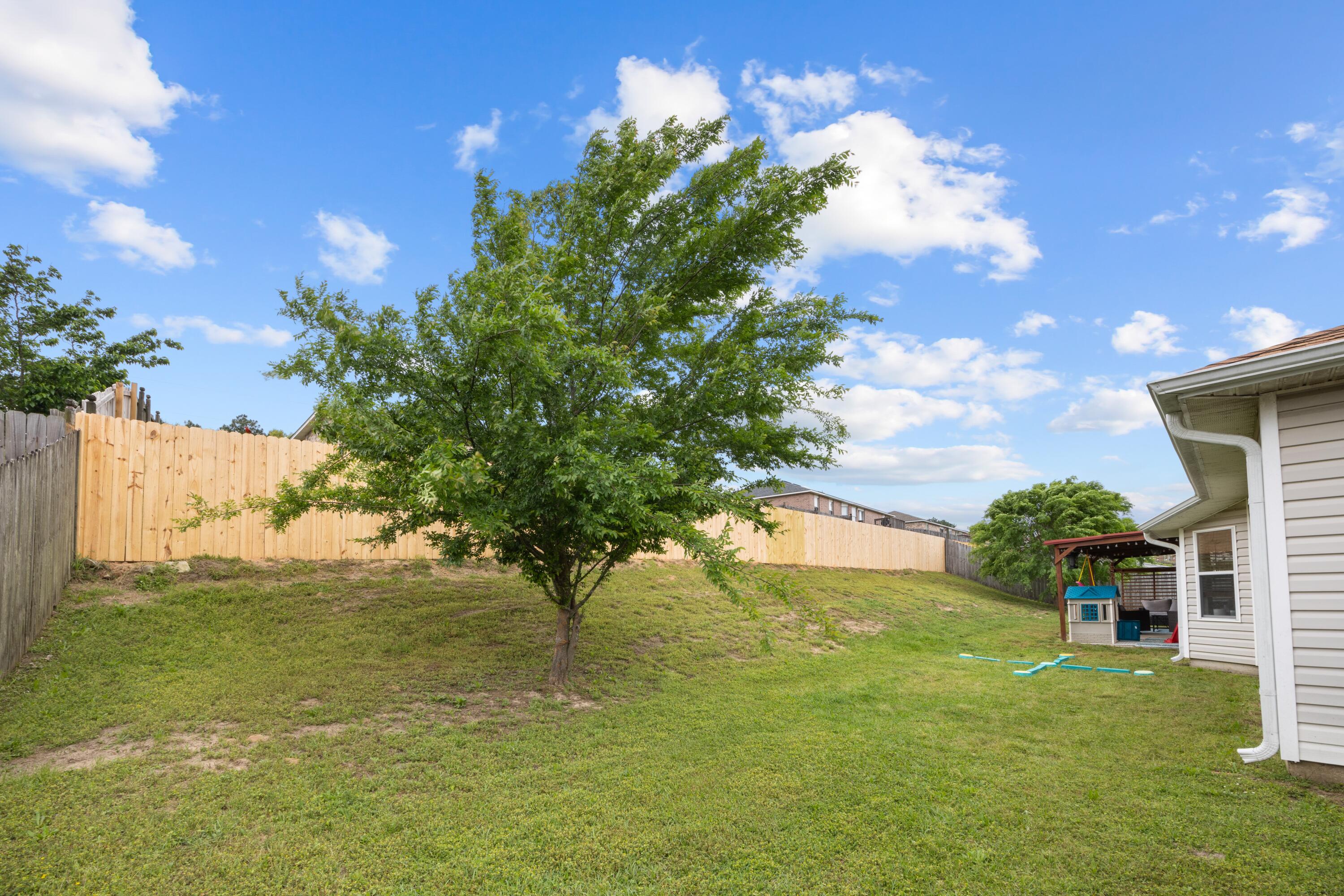 419 Bobby Drive Crestview, FL 32536 - Photo 36 of 42 a view of backyard with swimming pool