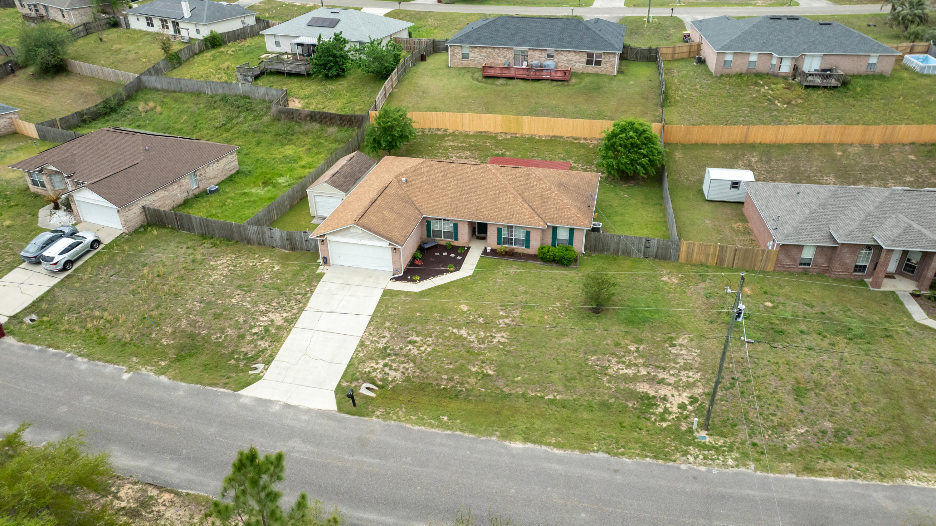 419 Bobby Drive Crestview, FL 32536 - Photo 39 of 42 an aerial view of residential houses with outdoor space and parking