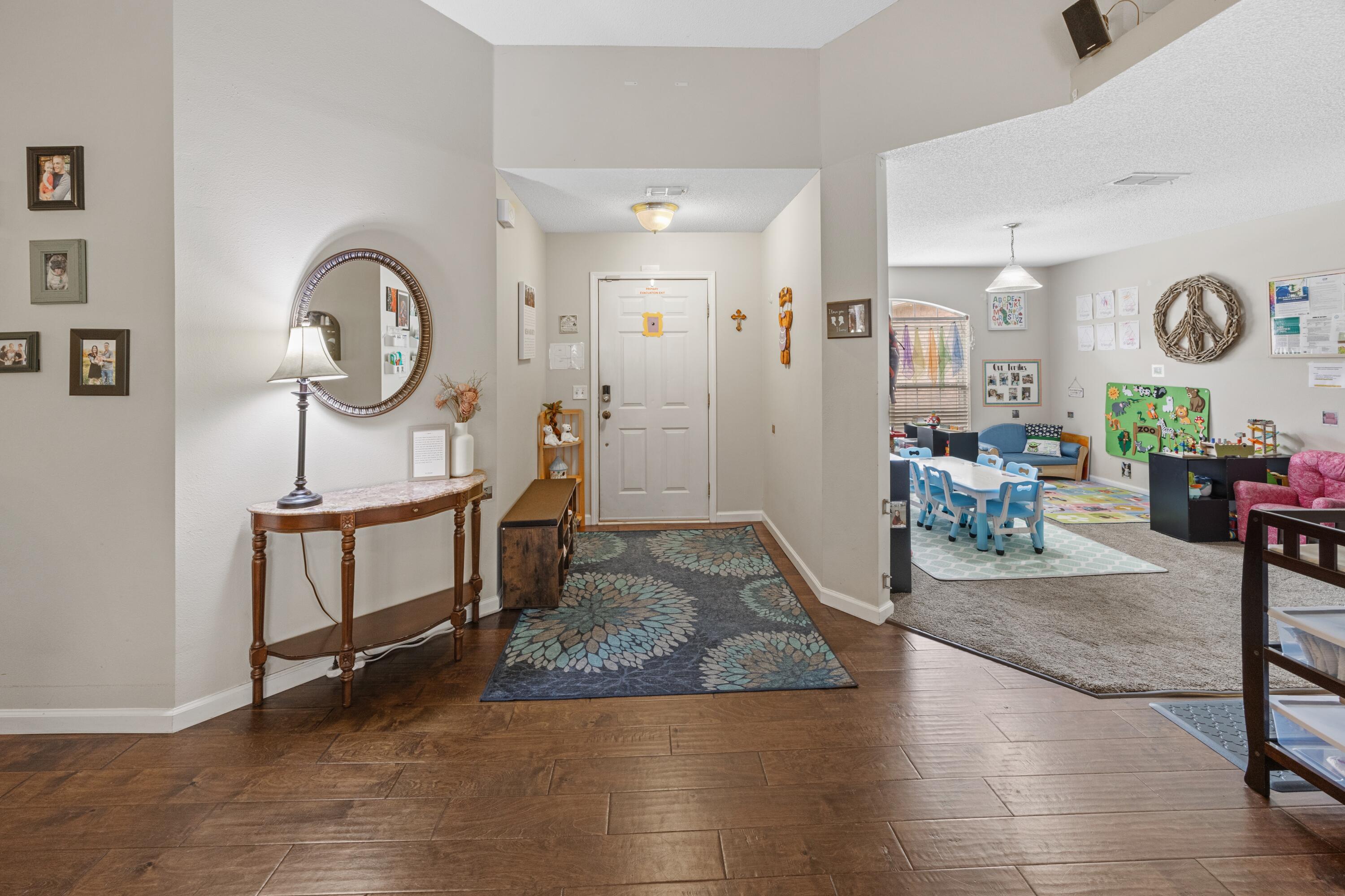419 Bobby Drive Crestview, FL 32536 - Photo 5 of 42 a living room with furniture a window and wooden floor