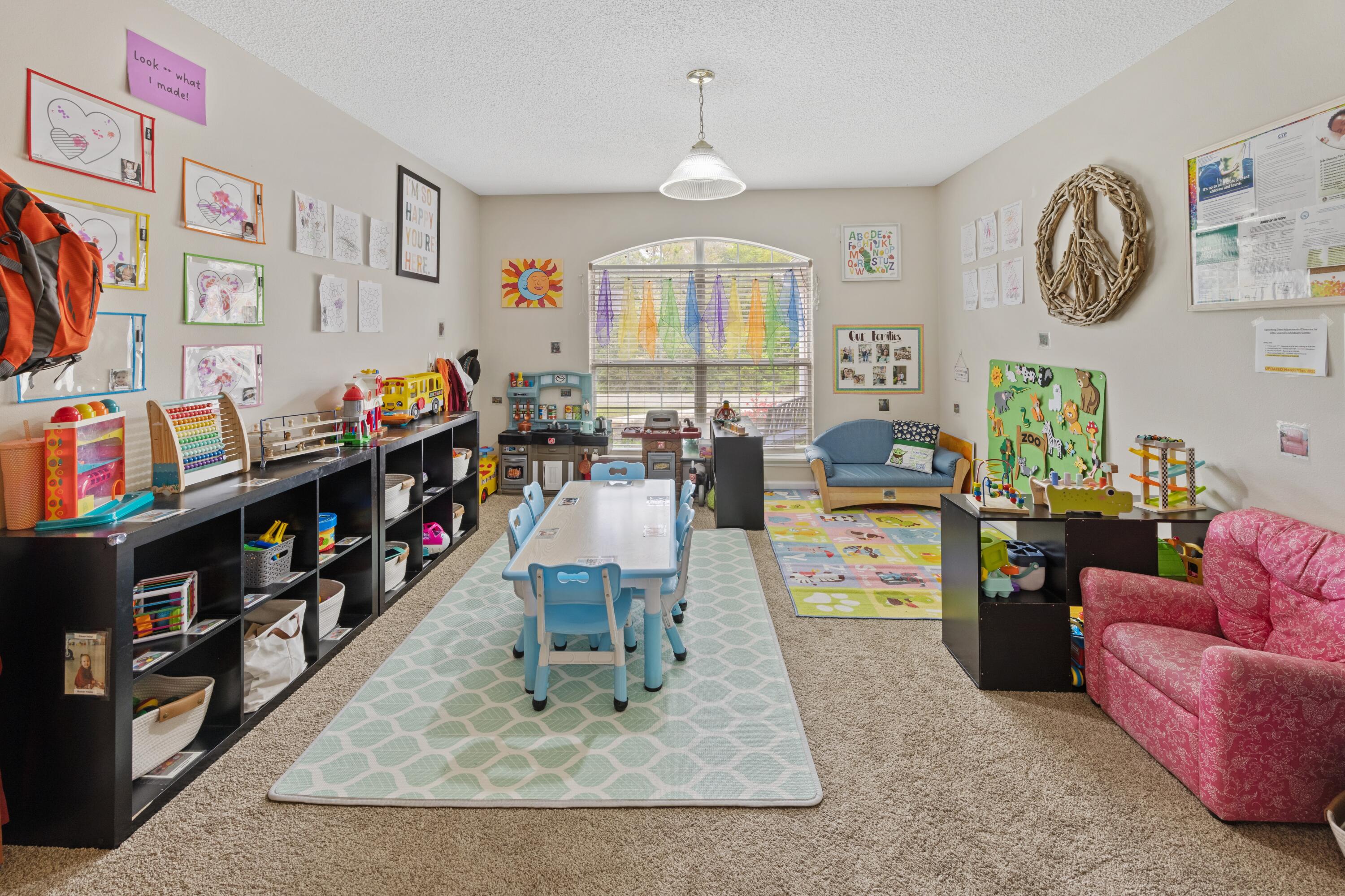 419 Bobby Drive Crestview, FL 32536 - Photo 9 of 42 a living room with lots of furniture and paintings on the wall