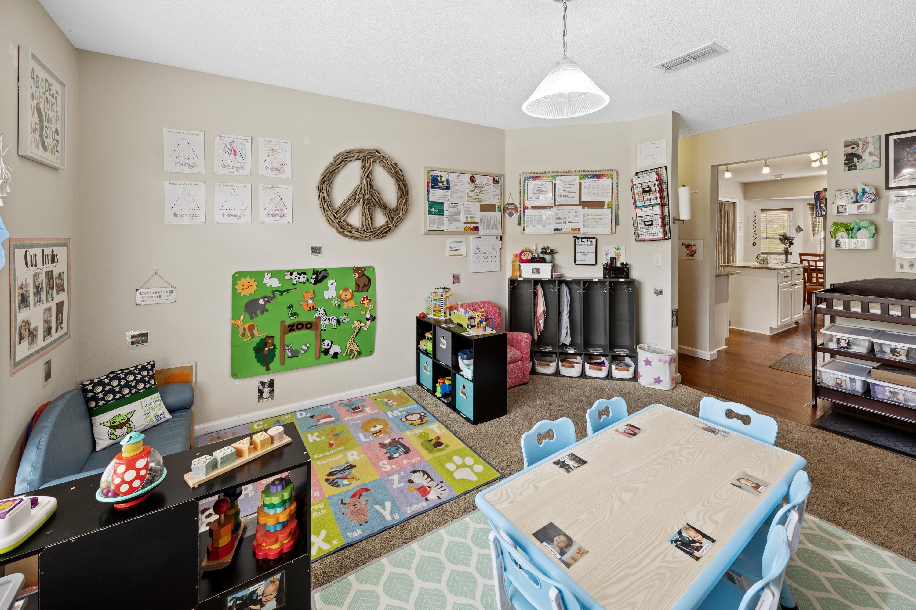 419 Bobby Drive Crestview, FL 32536 - Photo 10 of 42 a living room with furniture and a baby crib