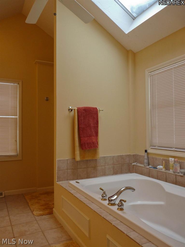 16532 Haskins Road Bainbridge, OH 44023 - Photo 7 of 19 SOAKING TUB AND SKYLIGHT ARE HIGHLIGHTS OF THE MASTER BATH