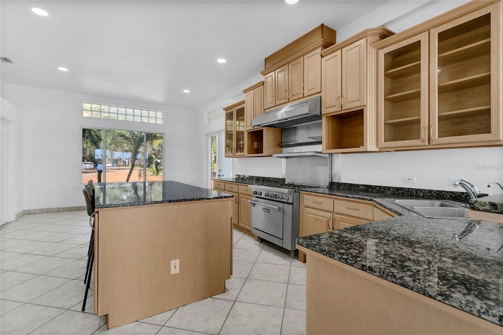 336 Mary Jess Road Orlando, FL 32839 - Photo 15 of 63 a kitchen with stainless steel appliances granite countertop a stove and a sink