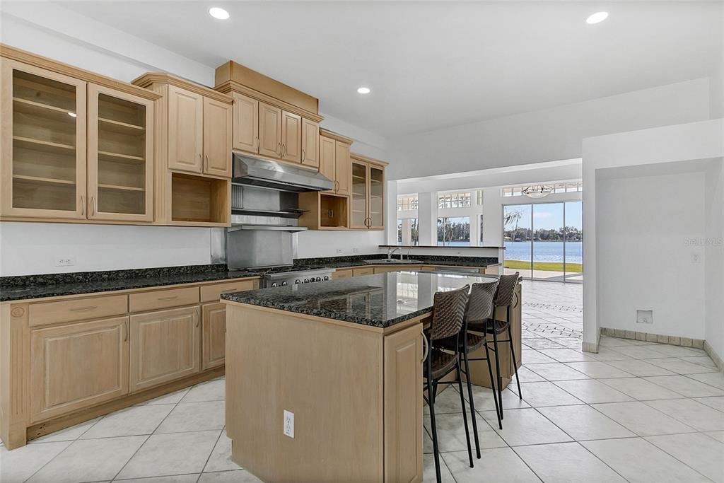 336 Mary Jess Road Orlando, FL 32839 - Photo 18 of 63 a kitchen with a stove a sink and a microwave