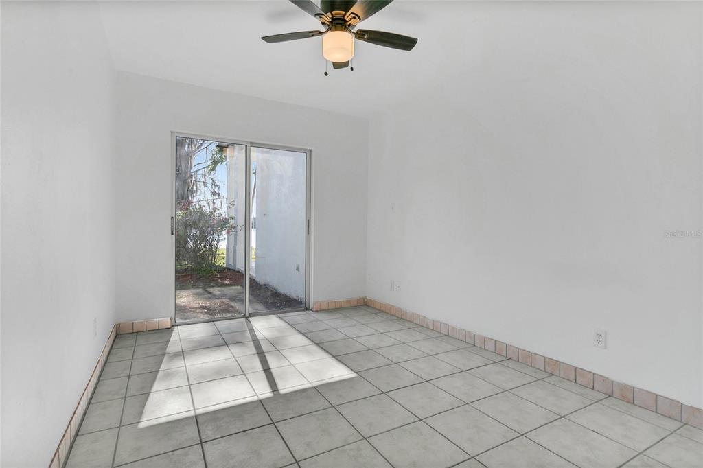 336 Mary Jess Road Orlando, FL 32839 - Photo 34 of 63 en empty room with windows and fan