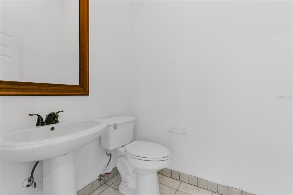 336 Mary Jess Road Orlando, FL 32839 - Photo 39 of 63 a bathroom with a sink a toilet and mirror