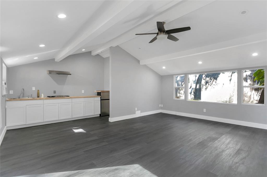 336 Mary Jess Road Orlando, FL 32839 - Photo 41 of 63 an empty room with wooden floor and windows