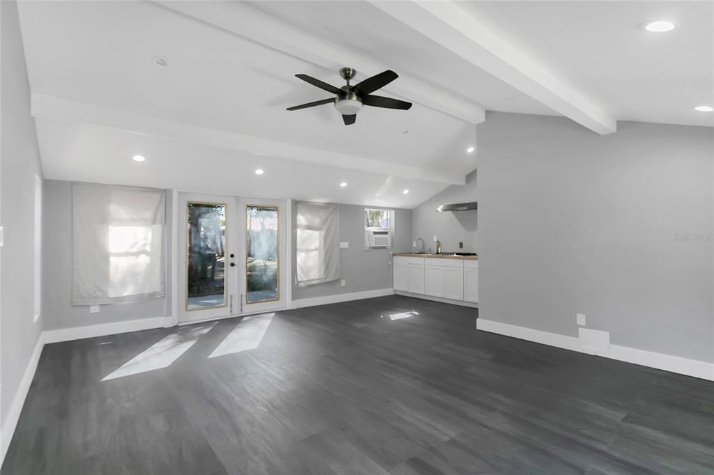 336 Mary Jess Road Orlando, FL 32839 - Photo 42 of 63 a view of an empty room with wooden floor and a window