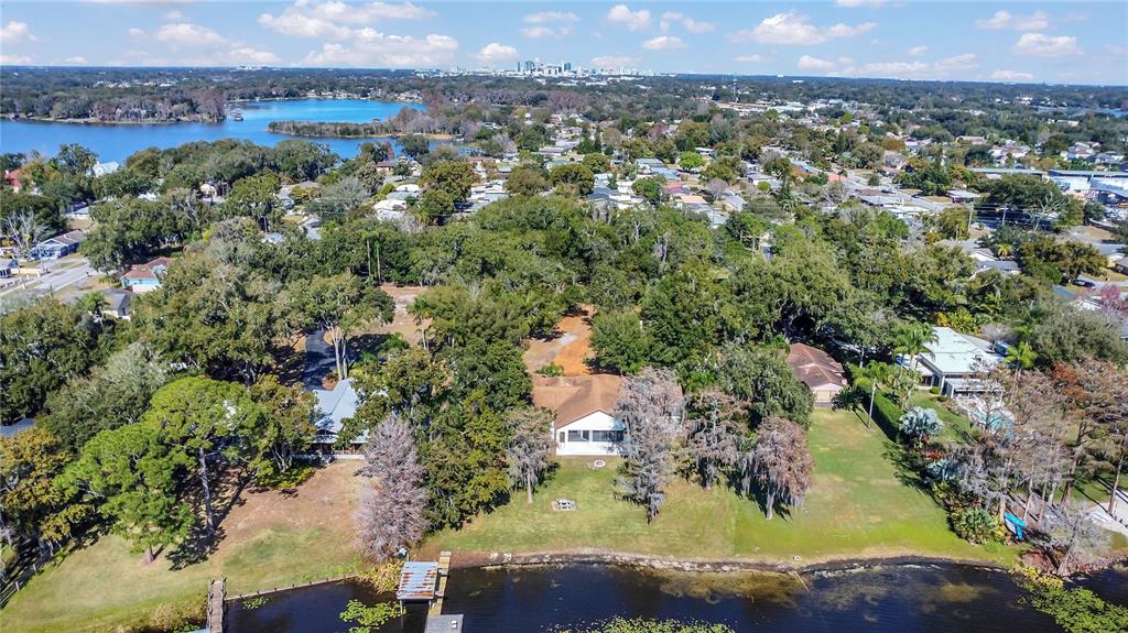 336 Mary Jess Road Orlando, FL 32839 - Photo 59 of 63 an aerial view of a residential houses with outdoor space and a lake view